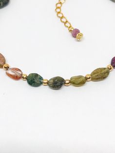 Handmade in Portland, Oregon. This will make the perfect gift! Or, definitely get it for yourself, I support that, too. MEASUREMENTS + MATERIALS - One size fits most because of the adjustable clasp - Pretty Tourmaline gemstone colored on a gradient - Gold fill accent beads - Gold fill findings for sensitive skin (hypoallergenic) - Gold or Silver available! - Great by itself or with a stack! WHAT PEOPLE SAY “Beautiful craftsmanship, these were for my mother in law, she loves them. I love supporti Adjustable Tourmaline Gemstone Beads Jewelry, Elegant Adjustable Tourmaline Bracelets, Adjustable Tourmaline Bracelet Jewelry, Tourmaline Bracelets With Natural Stones, Gold Bracelets With Natural Stones And Tourmaline, Gold Tourmaline Gemstone Bracelets, Gold Tourmaline Bracelets With Natural Stones, Gold Tourmaline Bracelet Jewelry, Gold Tourmaline Bracelet