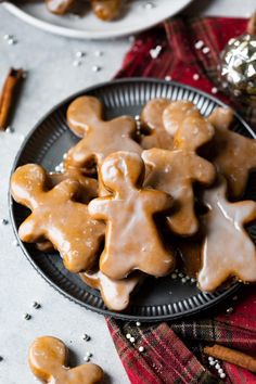 two plates filled with ginger cookies on top of a table