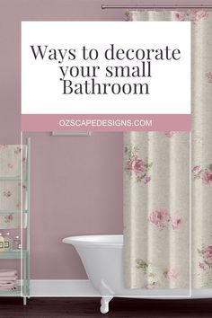 a bathroom with pink walls and floral shower curtain