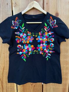 "Beautiful! Hand embroidered t- shirts ! One of a kind embroidered t- shirts ! Comfortable, fresh , one if a kind t- shirts ! Fabric : cotton. Care : hand wash/hang to dry/ low iron / NO BLEACH. MEASUREMENTS: Length: 24.5 Armpit to armpit: 20\"	is_active	20458565	Apparel & Accessories > Clothing > Shirts & Tops	https://www.etsy.com/listing/984295898/size-medium-6us-hand-embroidered-t-shirt	clothing > womens_clothing > tops_and_tees > tshirts > graphic_tees	https://i.ets Multicolor Embroidery Short Sleeve Tops For Festival, Relaxed Fit Multicolor Embroidered Tops, Traditional Cotton T-shirt For Summer, Multicolor Embroidery Short Sleeve Festival Tops, Festival Cotton Tops With Floral Embroidery, Cotton Tops With Floral Embroidery For Festival, Embroidered Cotton Top For Festival, Custom Embroidered Short Sleeve Shirt For Summer, Cotton Floral Embroidered Tops For Festivals