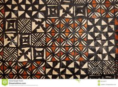 an old piece of art that is on display in a store window, with black and white geometric designs