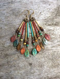 Multi coloured Bohemian leaf earringsBoho Chic earrings | Etsy Diy Boho Earring Ideas, Bohemian Earrings Dangles, Diy Boho Jewelry Earrings, Bohemian Bronze Drop Earrings, Bohemian Brass Beaded Earrings With Ear Wire, Bohemian Multicolor Czech Glass Beaded Earrings, Bohemian Multicolor Beaded Earrings In Czech Glass, Handmade Bohemian Brown Earrings, Handmade Bohemian Czech Glass Beaded Earrings