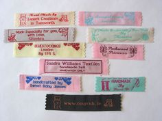 some type of name tags on a white surface with words written in different colors and shapes