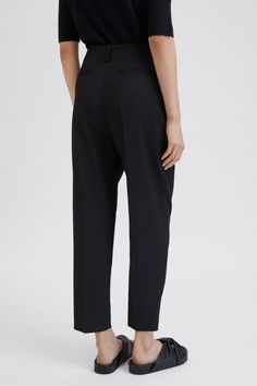 Karlie Trouser | Filippa-k.com Chic Black Wool Dress Pants, Wool Pantsuit With Pressed Crease For Business Casual, Tapered Leg Wool Bottoms For Work, Wool Tapered Leg Bottoms For Work, Classic Wool Business Casual Pantsuit, Classic Wool Pantsuit For Business Casual, Timeless Wool Bottoms For Workwear, Timeless Wool Dress Pants For Work, Classic Ankle-length Pantsuit For Work