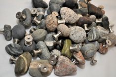 many different types of rocks and stones on a white surface