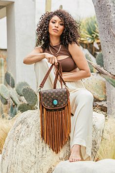 Compact, versatile and cleverly designed with an exterior easy access pocket, the World Traveler is an ideal go-everywhere bag. This messenger-style look is lightweight and roomy yet emanates effortless boho-chic. The Shorty Strap on the model's bag can be purchased separately here. Dimensions: Width: 9.5" x Height: 9.5" Depth: 3" Fringe Length: 12" Strap Options Option 1: (NEW!) Adjustable crossbody strap that can adjust from 30" to 57" Option 2: 47" Crossbody strap Guarantee Of Authenticity We Cheap Travel Shoulder Bag With Tassels, Luxury Tassel Shoulder Bag For Travel, Luxury Bohemian Shoulder Bag With Adjustable Strap, Louis Vuitton Fringe Purse, Cruise Packing, Vintage Designer Bags, Bahamas Cruise, Limited Edition Bag, Fringe Purse