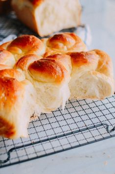 a loaf of bread sitting on top of a cooling rack