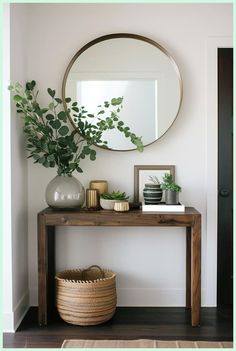 a wooden table topped with a mirror next to a plant