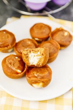 some mini pies are on a white plate