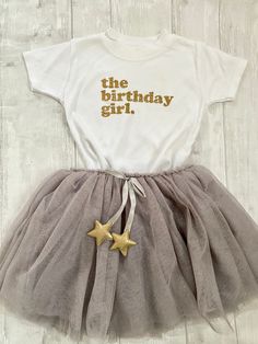 Gorgeous t-shirt for the little ones birthday. All coloured T-shirts come with white text. Shipped within 1-2 weeks of ordering but if you need it sooner then please send us a message and we can see what we can so. Birthday girl coloured T-shirts and birthday boy T-shirts also available please see our other listings. First Birthday Short Sleeve T-shirt With Text Print, First Birthday T-shirt With Text Print, Short Sleeve T-shirt With Text Print For First Birthday, Birthday Cotton T-shirt With Custom Text, Cute Birthday T-shirt With Funny Text, Custom Text Cotton T-shirt For Birthday, Cute Party T-shirt With Text Print, Custom Text Birthday T-shirt With Short Sleeves, Cute Letter Print T-shirt For Birthday Gift