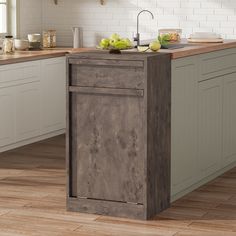 a kitchen island in the middle of a wooden floor