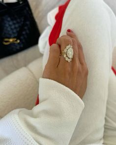 a woman's hand with a ring on it