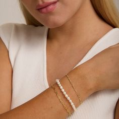 *Buy 2 items, Get 15% OFF your order. Coupon applied at checkout.* Have fun with our classic pearl bracelet. Perfect for that special occasion such as a birthday or wedding. Our timeless pearl bracelet elevates any day or night look. - Fresh water pearls, 18K gold vermeil - Bracelet width: 4.6mm - Adjustable size. Fits wrist sizes 6 - 8 inches. - Waterproof / Tarnish resistant / Hypoallergenic - 1 Year warranty All jewelry is handmade by hand from Heart Made of Gold. Style with our Pearl Strand Feminine Pearl Bracelets As Gift, Feminine Pearl Bracelet For Gifting, Elegant Gold Bracelet For Wedding And Mother's Day, Pearl Charm Bracelet For Wedding, Elegant Pearl Charm Bracelet For Wedding, Elegant Pearl Bracelet With Extender As Gift, Elegant Pearl Bracelet With Extender For Gift, Elegant Charm Bracelet For Wedding And Mother's Day, Classic Pearl Bracelet With Extender