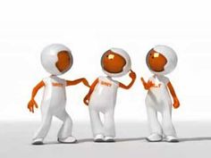 three small orange and white people standing next to each other