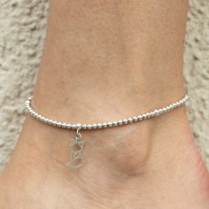 Summer trend, for beach and casual look. Finish your summer outfit with these anklets! The fine beads with a dainty cute charm make your anklet look extra special and fun. Each of these items are handmade bead by bead, so keep in mind that the sizing might differ in a few millimeters. Pair this anklet with more or wear this gorgeous one just by her own. To determine the size your ankle, please measure your ankle above the bone with a non-stretchy measuring tape (please ensure that the measuring Silver Minimalist Anklets For Gift, Minimalist Summer Anklets As A Gift, Minimalist Summer Anklets For Gifts, Minimalist Summer Anklets As Gift, Trendy Round Bead Anklets For Gift, Elegant Sterling Silver Bracelets For Summer, Elegant Sterling Silver Anklets For Summer, Silver Minimalist Flexible Jewelry, Hypoallergenic Summer Anklets As Gift