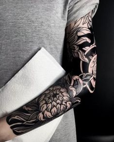 a person with a flower tattoo on their arm