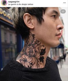 a man with a tattoo on his neck