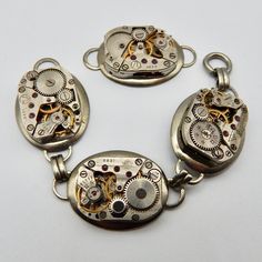 "Quantity: 4 pieces      from loop to loop 1 1/4\"x 3/4 wide Vintage Watch Movements, not working as a watch anymore, set in a 2 loop setting plated brass- perfect for bracelets and more Make your own SteamPunk Jewelry! I have lots of Antique and Vintage buttons and watch parts:    https://www.etsy.com/shop/nicojewel" Watch Parts, Steampunk Jewelry, Watch Movement, Vintage Buttons, Black Glass, Vintage Watches, Make Your Own, Etsy Accessories, Accessory Gift