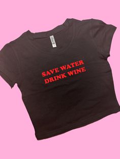 Save Water Drink Coffee SNUG FIT Crop Top | Cute Crop Top | Graphic Top | Gift For Her | Y2K crop top | Gift for friend | Baby Tee Comfy Top to Lounge in! Actual item may be lighter/darker than pictured. M A T E R I A L S - SNUG FIT - 100% RING SPUN COTTON - Shoulder Taping S I Z I N G - Size chart is available on our listing photos. S H I P P I N G  &  P R O D U C T I O N  T I M E - Production Time is 5 Business Days. (May be delayed during the Holiday Season) - Shipping Time is 2-6 Business Da Fitted Black Crop Top With Logo Print, Black Letter Print Crop Top For Summer, Fitted Logo Print Crop Top For Summer, Summer Cropped Shirt With Logo Print, Fitted Slogan Crop Top For Summer, Fitted Casual Crop Top With Letter Print, Fitted Cropped T-shirt With Letter Print For Summer, Fitted Crew Neck Crop Top With Text Print, Black Y2k Cropped Shirt For Summer