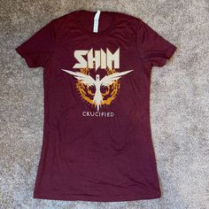 Brand New Shim Concert T-Shirt. Size Large. Color Maroon. Sizing Seems Subjective On Women’s Clothing. Please See Measuring Tape To Verify The Size Will Fit You. Have Multiple T-Shirts. Red Band Logo T-shirt, Cotton Tri-blend Tops With Band Logo, Red Band Merch Top With Logo, Red Screen Print T-shirt For Concerts, Red Graphic Tee With Band Logo, Red Band Logo Graphic Tee, Fitted Crew Neck Shirt With Band Merch, Red Band Logo T-shirt Merch, Red Band Logo T-shirt With Crew Neck