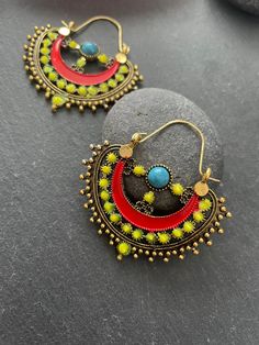 "This Unique pair of Earrings is designed and crafted at PraNiCollectioNs  PraNiCollectioNs is the place for anyone who Is in lookout for a latest trend with an ethnic touch.  We at PraNiCollectioNs offers a great range of Indian Ethnic jewellery's. We are strongly committed to  providing our customers  some uniquely handcrafted products with utmost satisfaction. These jewellery's are made from high quality  material which are Hypoallergenic and are also free from corrosion and rusting This list Handmade Metal Drop Chandbalis, Bohemian Brass Chandbalis For Festive Occasions, Bohemian Multicolor Hoop Earrings, Handmade Metal Chandbalis, Bohemian Multicolor Hoop Earrings For Festival, Bohemian Brass Hoop Earrings, Handmade Green Bohemian Plug Earrings, Bohemian Gold Plug Earrings For Festivals, Bohemian Hoop Earrings For Festive Occasion