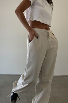 l Oversized Pants    l 100% Polyester   * MODEL IS 5'7″ AND IS WEARING A SMALL. Relaxed Baggy Everyday Bottoms, Relaxed Wide-leg Pants For Streetwear, Sporty Beige Straight Leg Bottoms, Wide Leg Solid Cargo Pants For Everyday, Relaxed Baggy Pants For Everyday, Relaxed Wide Leg Parachute Pants With Pockets, Casual Wide Leg Parachute Pants For Everyday, Everyday Baggy Wide-leg Pants, Oversized Pants