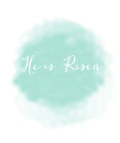 the words he is risen written in white ink on a blue watercolor circle background