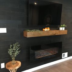 a television mounted above a fireplace in a living room