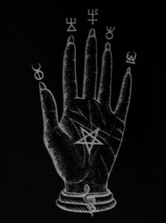 hand with pentagramus and symbols drawn on it