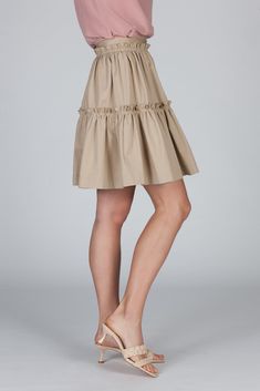 The Elena Skirt has a romantic silhouette and a playful feel. This tiered skirt with a fixed waistband and a concealed back zip closure, is cut from our crisp cotton poplin. It sits high at your waist and features trapunto top stitching to create texture. The gathered fabric allows for subtle volume --twirling will just come natural. Chic Tiered Voluminous Skirt, Spring Tiered Voluminous Skirt, Chic Voluminous Tiered Skirt, Chic Pleated Hem Tiered Mini Skirt, Chic Tiered Mini Skirt With Pleated Hem, Cotton Tiered Voluminous Skirt, Chic Gathered Cotton Mini Skirt, Chic Cotton Mini Skirt With Gathered Detail, Chic Cotton Mini Skirt With Pleated Hem