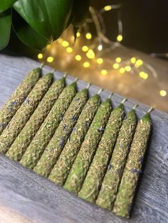 a bunch of green crackers sitting on top of a wooden table