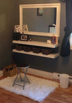 a room with a chair, mirror and shelf in it