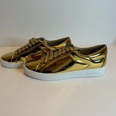 The Most Gold Sneakers You Can Get!! Michael Kors Ruth In Size 7. New In Box. Perfect For The Mummer’s Parade! Bling, Bling, Baby Gold Sneakers With Abzorb Midsole For Sports, Michael Kors Wedge Sneakers, Michael Kors Leather Sneakers, Michael Kors Lace-up Sneakers For Spring, Mk Sneakers, Michael Kors Leather Slip-on Sneakers, Michael Kors Sneakers Grey Gold And Silver, Michael Kors Wedges, Michael Kors Sneakers