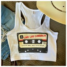 Long live cowgirls!  The perfect crop tank for a festival, concert or just lounging around lookin' cute! Summer Music Festival Tank Top With Graphic Print, Trendy Cotton Tank Top For Festivals, Trendy Cotton Festival Tank Top, Retro Fitted Racerback Tank Top, Summer Tank Crop Top With Graphic Print, Summer Graphic Print Tank Crop Top, Summer Graphic Print Racerback Crop Top, Fitted Graphic Print Tank Top For Festivals, Fitted Western Tank Top For Summer