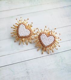 Sparkle heart earrings White gold beaded earrings Shiny stud heart earrings Beaded earrings Fashion earrings Trendy earrings Trendy earrings in the shape of a heart.For your bright image! Length : 4 cm( 1.8 inches) Product color may appear different depending on viewer's monitor condition. White Double Heart Earrings With Heart Beads, Heart-shaped Beaded Earrings, Gold Heart Beads Drop Earrings, Gold Heart Beads Earrings For Party, Gold Drop Earrings With Heart Beads, Gold Earrings With Heart Beads For Party, Handmade Heart-shaped White Earrings, Handmade White Heart-shaped Earrings, Gold Beaded Heart Earrings For Gift