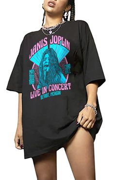 a woman wearing a black t - shirt that says janis joplinn live in concert