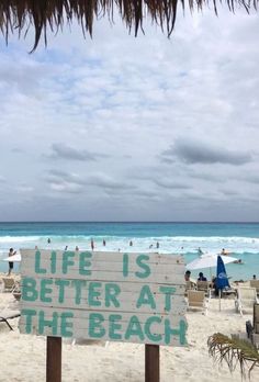 a sign that says life is better at the beach