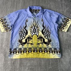 Vintage 2000s Steve & Barrys Abstract Design Dragon Flames Skater Y2K Aesthetic Basic Multi Color Button Up Shirt Double Extra Large Mens Condition:  Fair Used Condition  = Flaw On The Front Of The Shirt Due To Age And Wear  Measurements: Please see photos above for all measurements IF YOU BUY TWO OR MORE ITEMS USE THE CODE BUNDLE @ CHECK TO SAVE 20% WE SHIP WITHIN 24 HOURS AFTER PURCHASE! Please be aware that we do not offer free returns!! The Buyer is responsible for the cost of the return lab 90s Collared Tops For Streetwear, 90s Collared Graphic Print Top, 90s Blue Button-up Top, 90s Graphic Print Button-up Top, Printed Collared Top For Streetwear, 90s Style Button-up Shirt For Streetwear, Mens Closet, Tee Shirt Outfit, Design Dragon