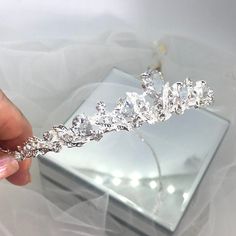 PERLA - Silver & Crystal Wedding Bridal Tiara A super sparkling tiara measuring 26mm high in the centre Swarovski Crystals make this tiara sparkle all over, a simply stunning piece. This beautiful Tiara comes packed in a pretty white box and is shipped with tracking. Feel free to look at all of my beautiful stock on any of my pages; www.bejewelledbridal.com.au www.facebook.com/bejewelledbridal.com.au www.instagram.com/bejewelled_bridal Thank you for visiting Bejewelled Bridal Tiara Simple, White Tiara, Silver Headpiece, Tiara Silver, Tiara Headpieces, Garden Theme Wedding, Silver Head Piece, Bridal Hair Accessory, Silver Tiara