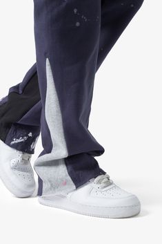 the Contrast Bootcut Sweatpants are designed with a relaxed fit throughout, featuring an elasticized self waist and leg opening, multi-colored paint splatter throughout, and finished with denim and contrasting panels at the inseam and outseam to provide a flare at the leg opening. details relaxed fit flared leg opening 55% cotton 45% polyester model is 6’1, 140 lbs and wears a size medium Streetwear Pants With Double-needle Straight Hem, Straight Leg Cotton Jeans With Paint Splatter, Straight Leg Paint Splatter Jeans, Relaxed Fit Bottoms For Streetwear With Standard Cut Leg, Relaxed Fit Bottoms For Streetwear, Urban White Loungewear Bottoms, Urban Straight Leg Loungewear Bottoms, Casual Spring Pants With Paint Splatter, Urban White Tapered Leg Bottoms