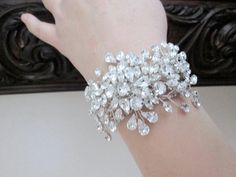 "This bracelet is made with Swarovski crystals and the silver plated components. Adjustable cuff bracelet. The decorative part measures about 4 3/4\" long and about 2\" wide. Available in gold or silver finish." Bridal Cuff Bracelet, Crystal Bridal Earrings, Bracelet Wedding, Swarovski Bracelet, Wedding Jewelry Bracelets, Crystal Stars, Pearl Hoop Earrings, Bracelet Cuff, Bridal Bracelet