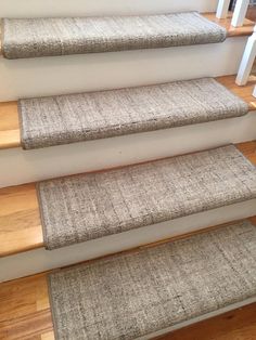 the carpeted stairs are clean and ready for us to go down them into the house