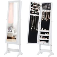 a white mirrored jewelry cabinet next to a mirror