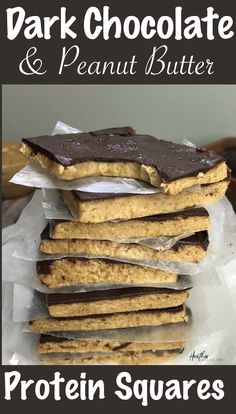 chocolate and peanut butter protein squares stacked on top of each other with text overlay