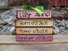 a stack of wooden blocks with the names of two people