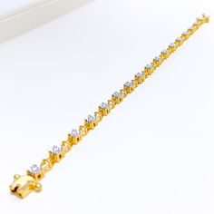 This timeless 18k gold bracelet, weighing 10.9 grams, features a classic design adorned with 0.52 carats of round brilliant cut diamonds. The diamonds have a color grade of F-G and a quality grade of VS, adding exceptional sparkle and elegance. The yellow gold finish enhances its luxurious appeal, making it perfect for any special occasion. The bracelet has a size of 7 inches, offering both style and comfort. This piece is openable, designed with a push snap lock and clasps for added convenience Diamond Gold Bracelet, 18k Gold Bracelet, Snap Lock, Round Brilliant Cut Diamond, Bracelet Sizes, Round Brilliant, Gold Finish, Timeless Beauty, Colored Diamonds