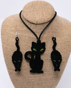 "These cute cat earrings and pendant are a \"must have\" to show off your wardrobe. These lacy items will dress up any outfit and are definitely appropriate for Halloween! The Pendant is 2\" long by 1.25\" wide and is fastened to a 24\" long polyester cord with a satin finish . You can tie it as long or short as you wish (just make sure to make a tight knot). The earrings are 2\" long by .75\" wide and are fastened to hooks made of stainless steel. These would be a great addition to your Hallowe Party Jewelry With Cat Design And Cat Ears, Party Jewelry With Cat Design, Halloween Black Cat Design Jewelry, Black Halloween Jewelry With Cat Ears, Goth Things, Cat Pendant, Cat Pendants, Santa Ornaments, Star Ornament