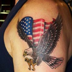 an eagle with the american flag on it's back is shown in this tattoo