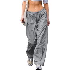 Elevate your fashion sense with these amazing baggy cargo pants and give your personality an enticing vibe. These loose hip-hop pants are elegantly made and are super-stylish as well. Premium materials are used in making and these are quite comfortable and durable as well. These pants are available in different color options, so choose your favorite one. Specifications: Fabric Type: Synthetic Care Instructions: Hand Wash Only Closure Type: Drawstring Rise Style: High Rise About this Item: Materi Wide Leg Parachute Pants For Summer Outdoor Activities, Summer Wide Leg Parachute Pants For Outdoor, Summer Outdoor Wide Leg Parachute Pants, Summer Outdoor Relaxed Fit Parachute Pants, Baggy Hip Hop Parachute Pants, Baggy Hip Hop Parachute Trousers, Baggy Hip Hop Parachute Pants For Summer, Hip Hop Style Baggy Harem Pants With Pockets, Hip Hop Baggy Parachute Pants For Summer