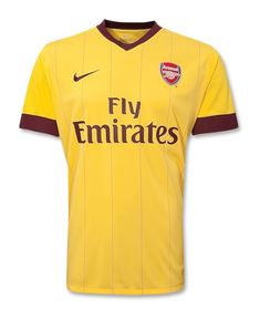 a yellow soccer jersey with the word, fly emiratess on it